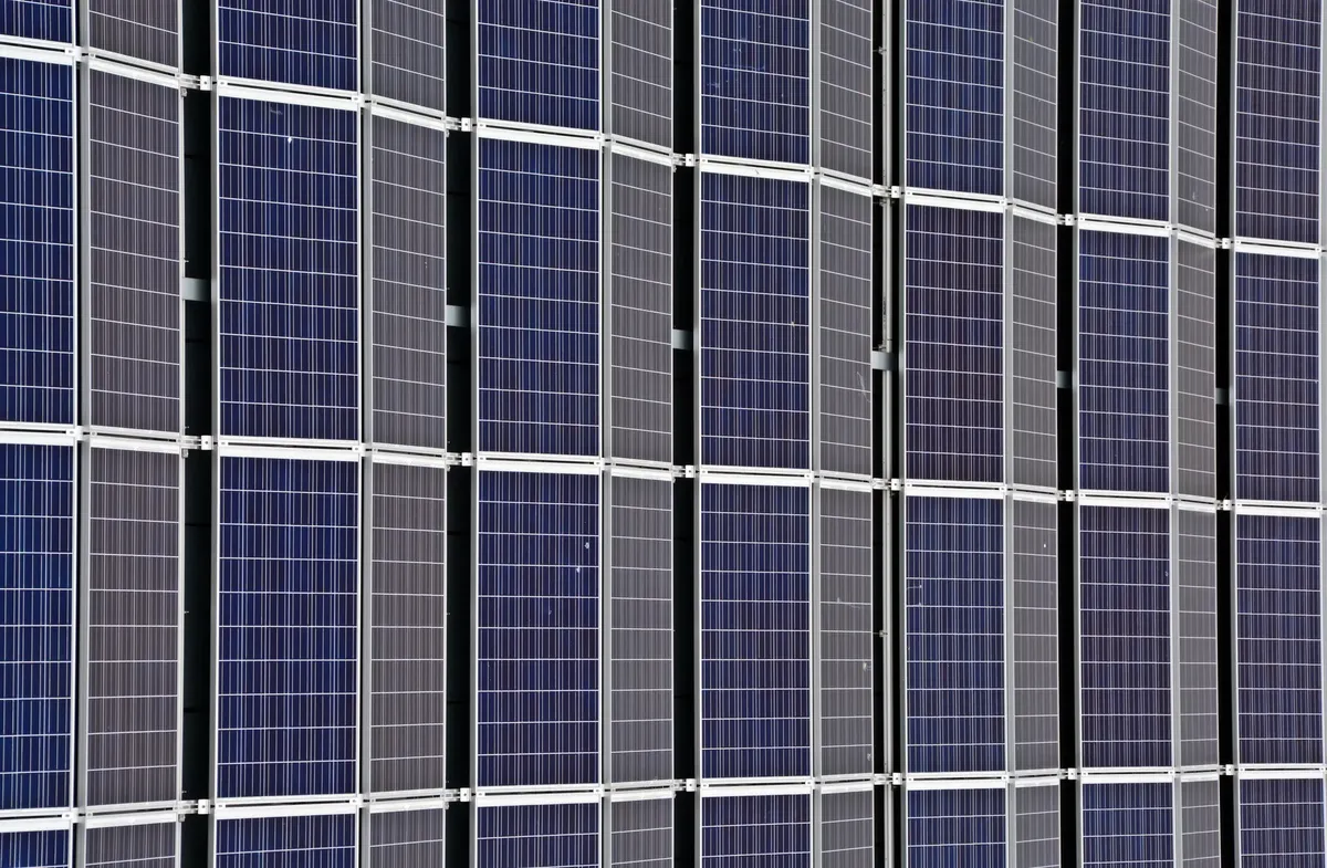 Close-up of multiple solar panels representing renewable energy and sustainability.