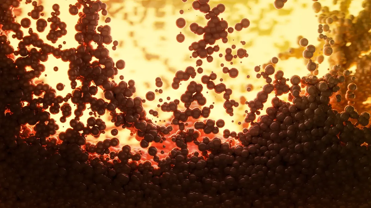 Dynamic abstract image of molecules with vibrant warm tones, highlighting scientific visualization.